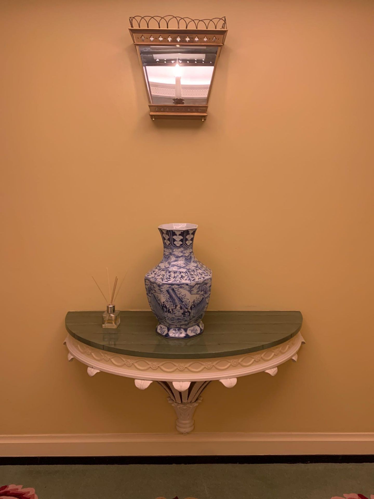 A Wall Mounted Console Table With A White Cast Metal Acanthus Base With A Carved Wooden Apron With A