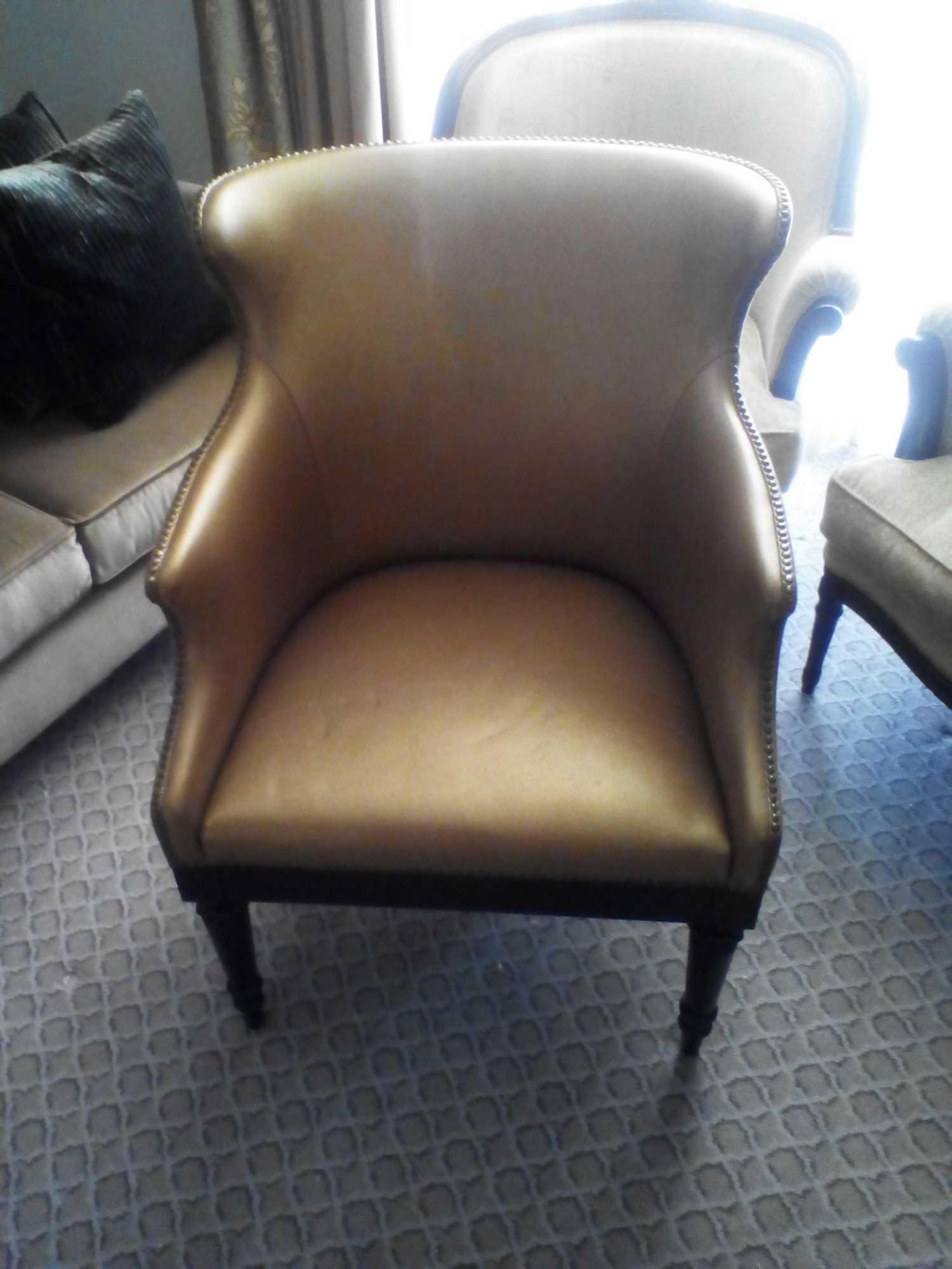 A Leather Tufted Armchair With Chesterfield Style Button And Stud Detail 60 x 63 x 95cm (Room 105)