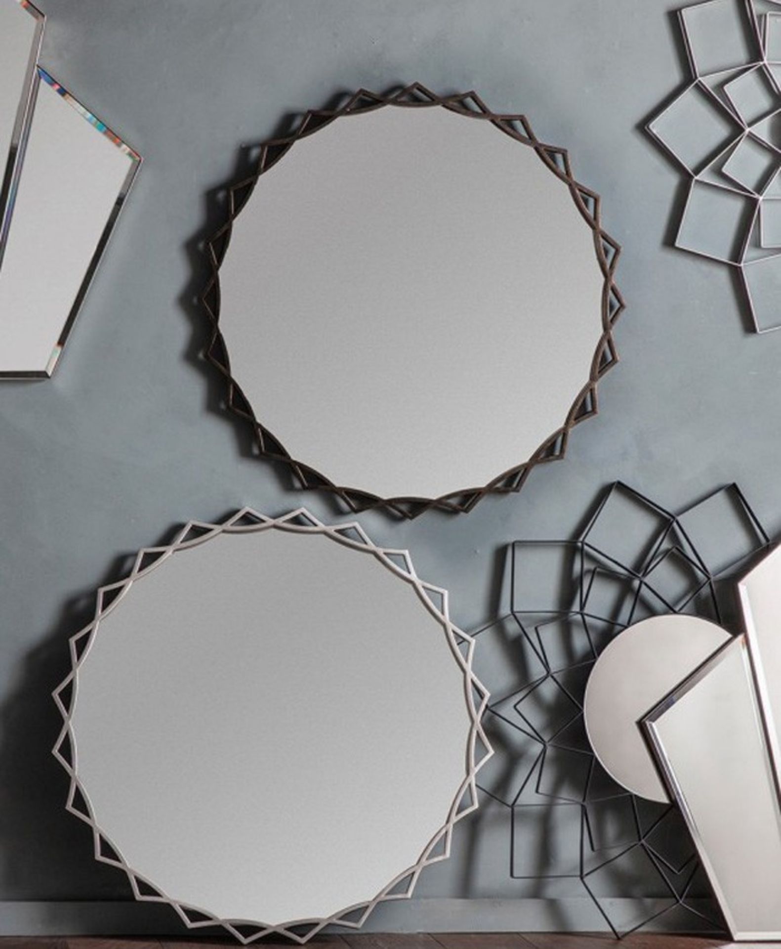 Novia Mirror Bronze This Modern Round Wall Mirror has a overlapping bronze coloured frame As round