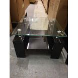 Dana Coffee Table A contemporary tempered glass top coffee table with black frame accents 100 x 60 x