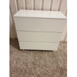 Tall three-drawer chest of drawers is a compact and functional piece of bedroom furniture. It has