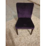 A purple velvet plush side chair with piped accent trim to the slightly flared back 500 x 450 x