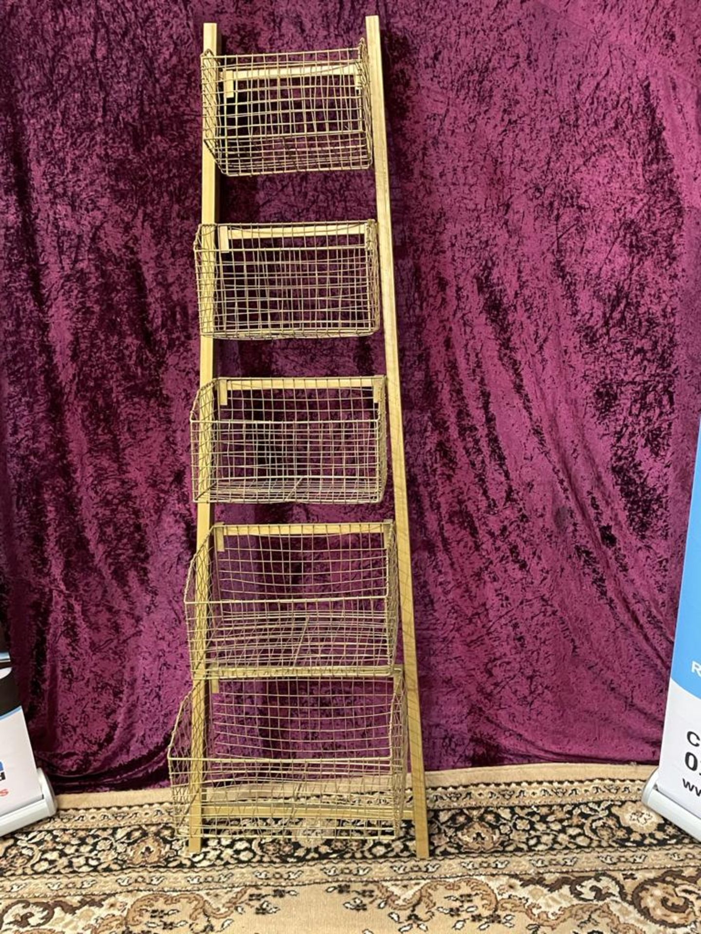 Basket Ladder Metal and Bronze Our large Storage Basket Ladder features five sturdy wire baskets