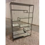 Open Display A Stunning Metal Frame Features A Multi-Level Mirrored Glass Shelving Design Of Sleek