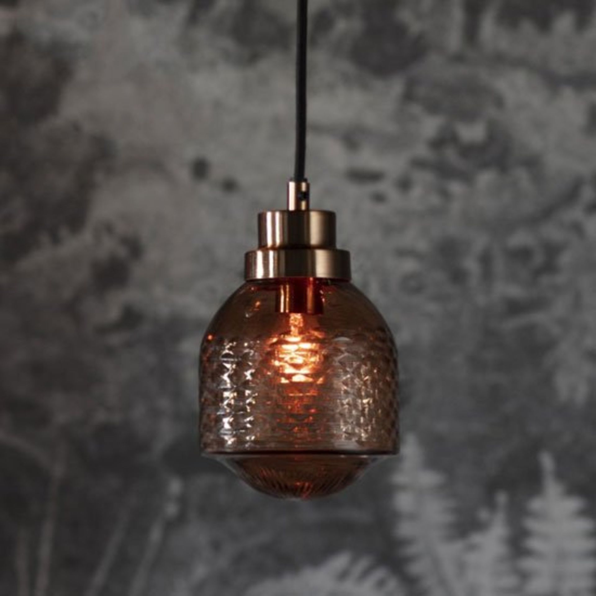 Thorson Pendant Light Modern pendant light featuring metal fixtures and a tinted and textured