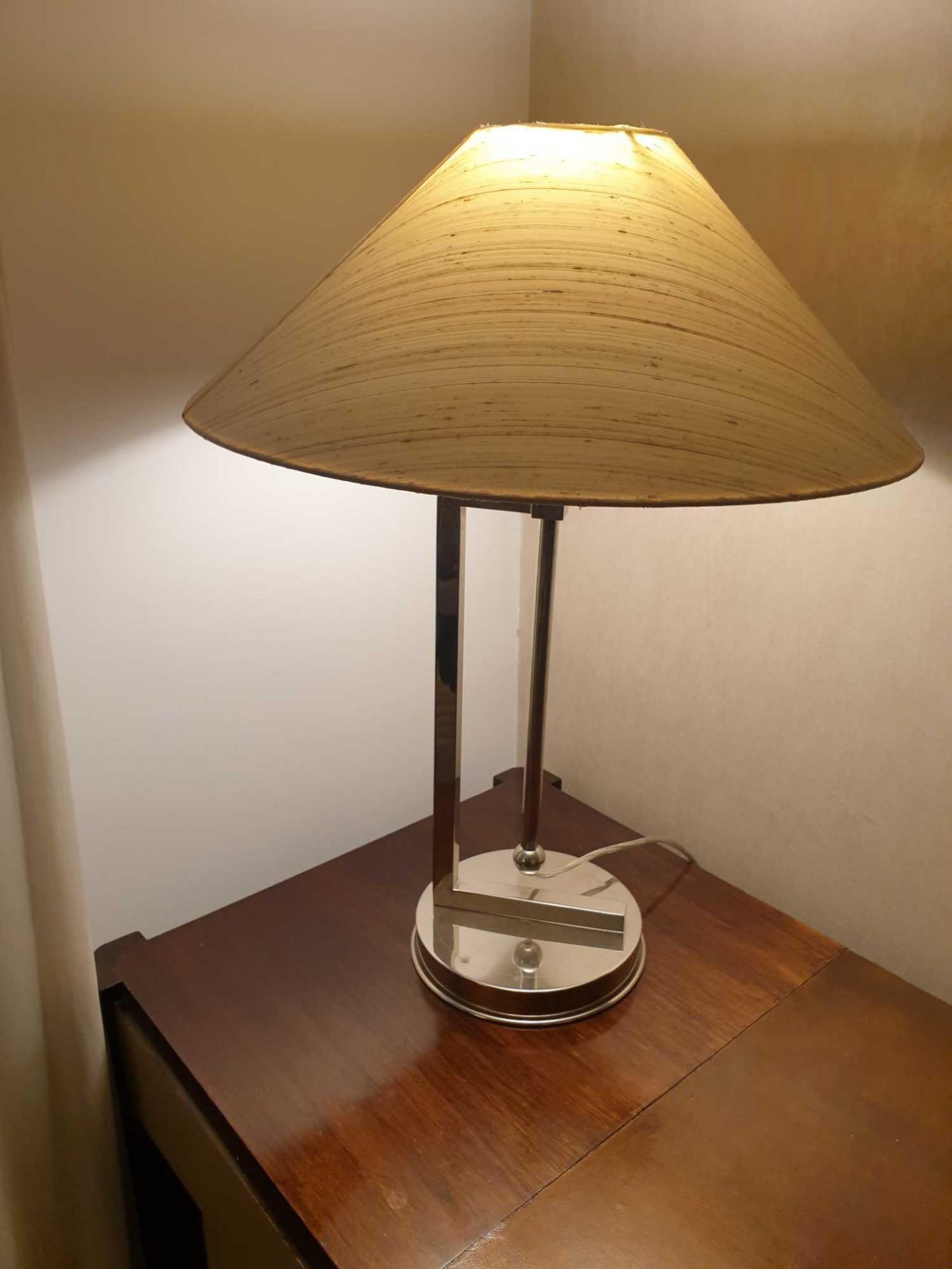 A Pair Of Polished Nickel Table Lamps Circular Base And Double Stem Single Bulb With Cylindrical