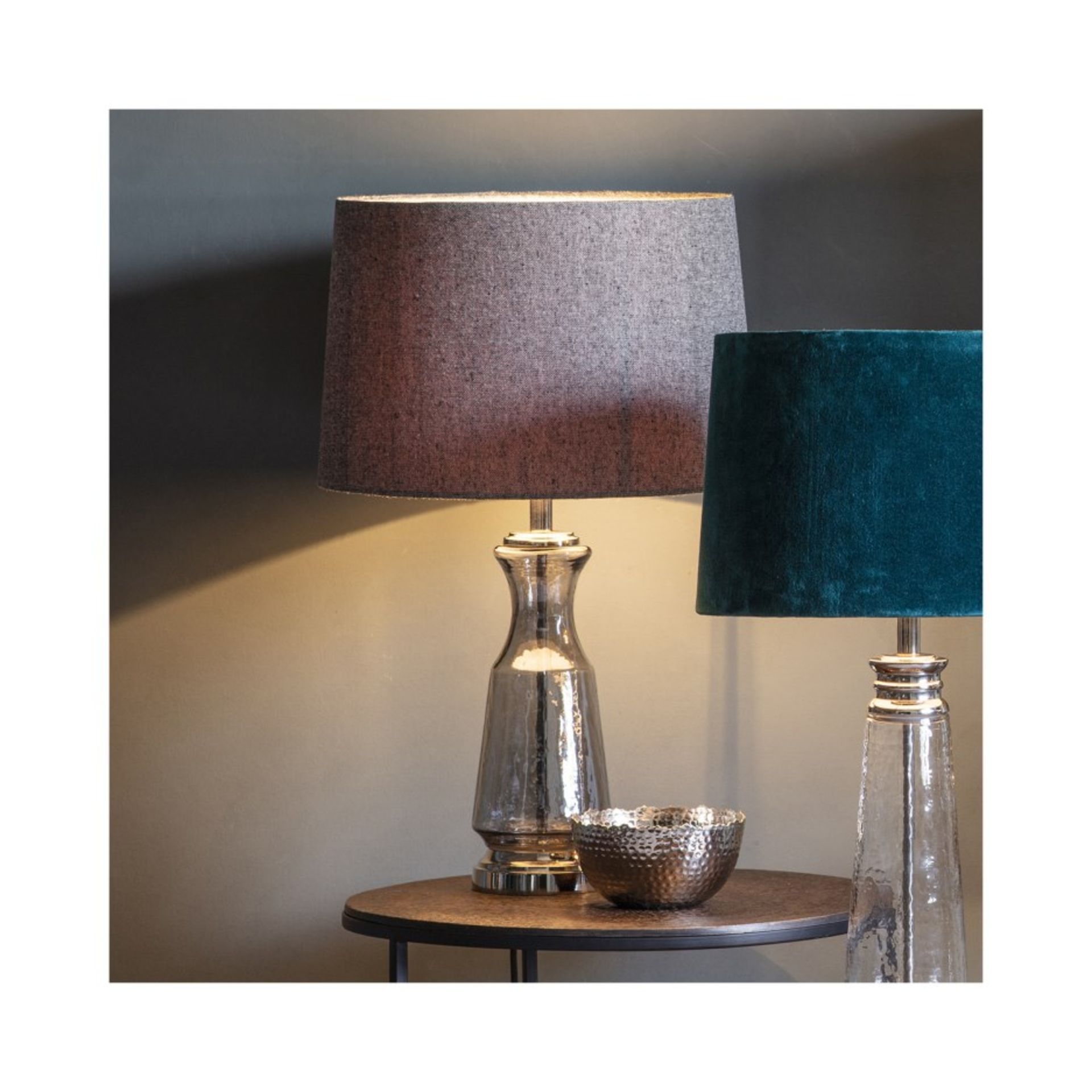 Lastrea table lamp a stunning glass based lamp with silver detailing, supplied with a grey shade.