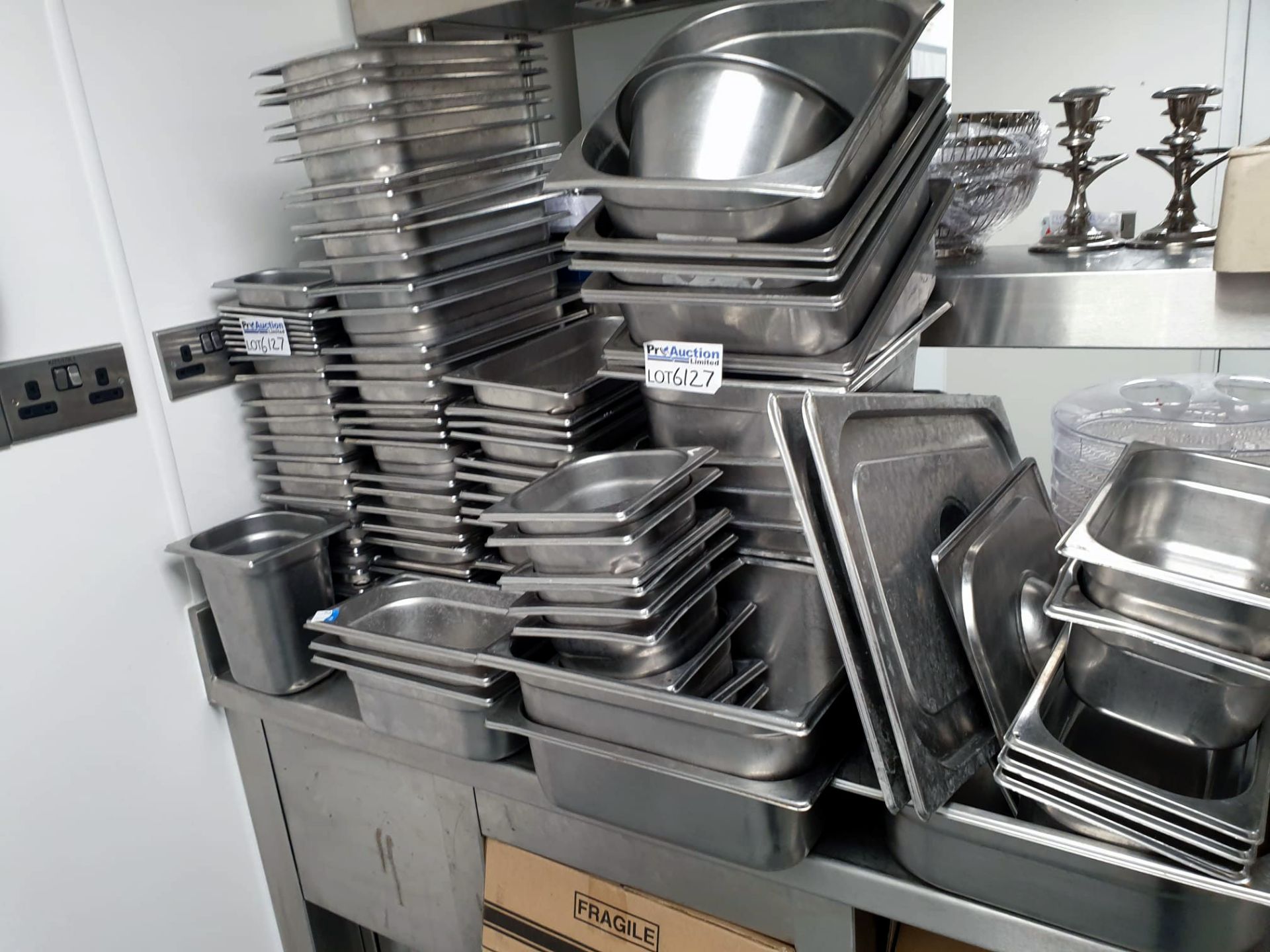 A large quanity of various gastronorm pans