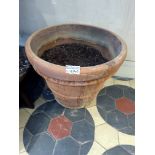 A terracotta coloured stone planter 80 x 80 x 64cm