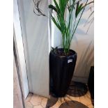 A large composite planter tall 43 x 90cm