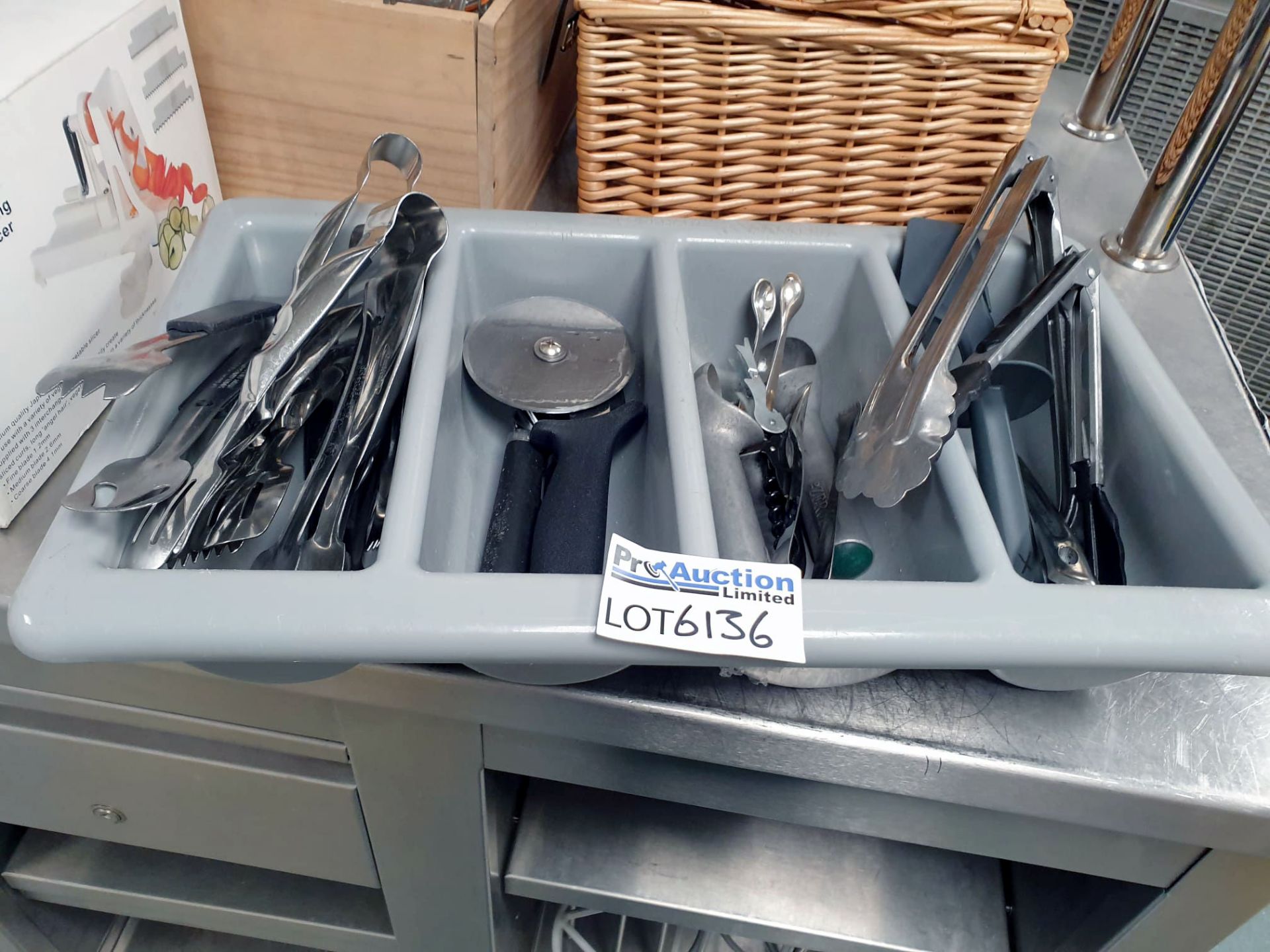 Various utensils as found to include tongs, pizza cutters, ice cream scoops