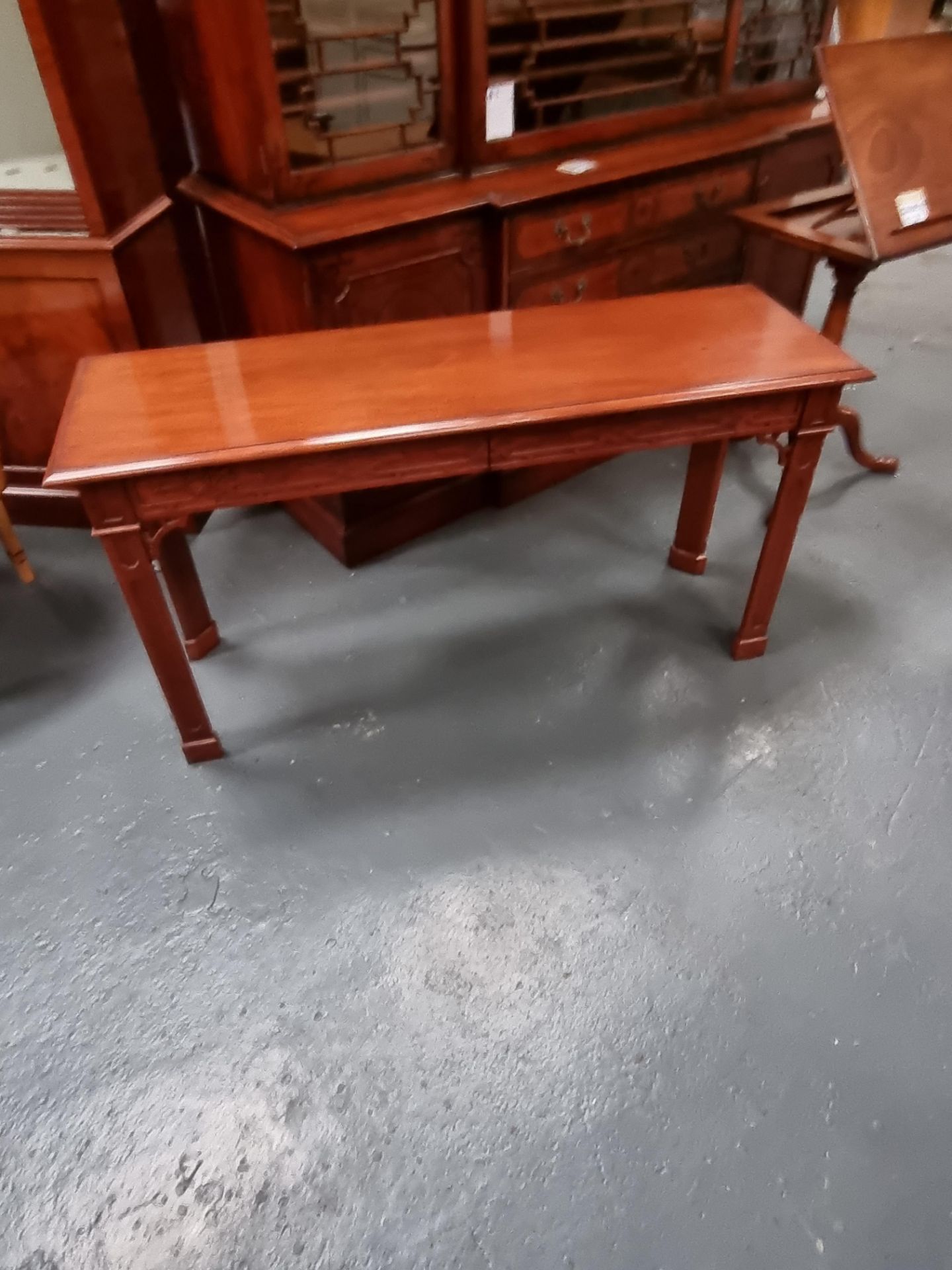 Arthur Brett mahogany sofa/side table with Fretwork decorated front and sides and fitted with two