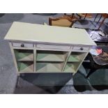 Console unit in white and silver leaf and bevel edge detail with two drawers, 6 shelves with