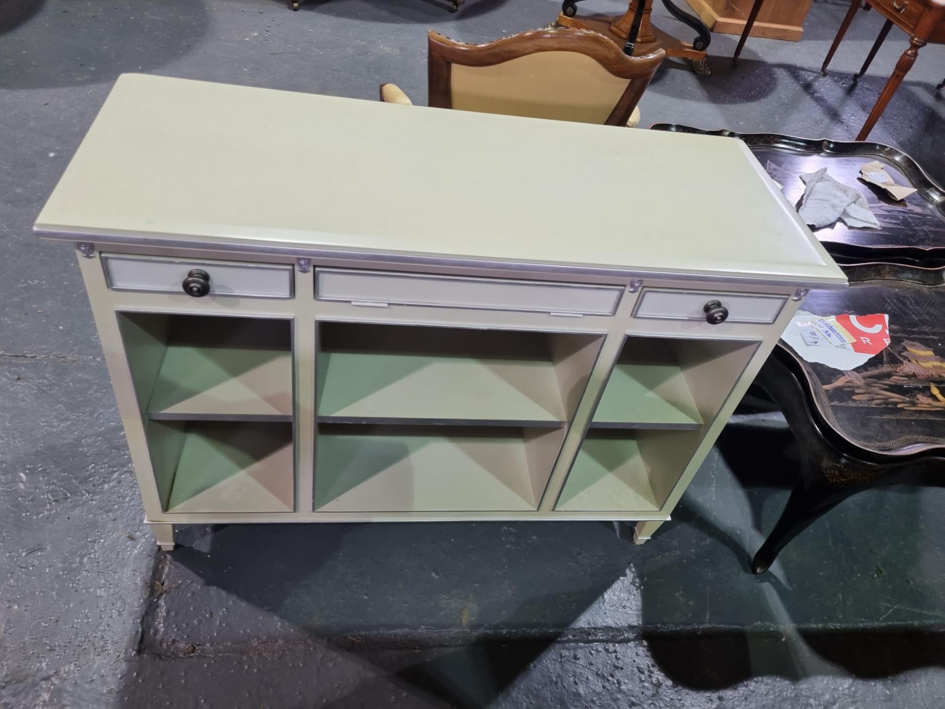 Console unit in white and silver leaf and bevel edge detail with two drawers, 6 shelves with