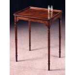 Arthur Brett Mahogany end table of small size on finely turned legs and with low three sided gallery