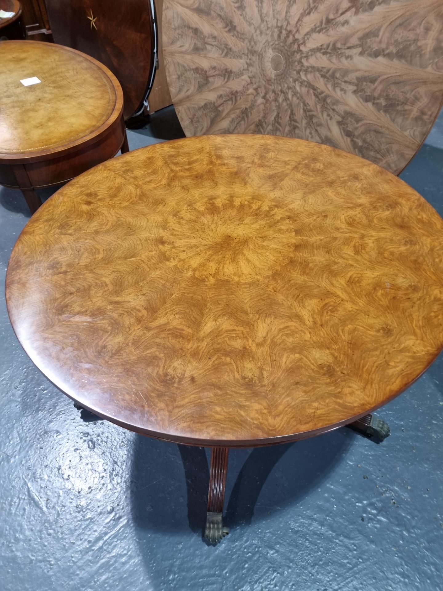 Arthur Brett Mahogany circular dining table on single pedestal with five legs on brass claw feet