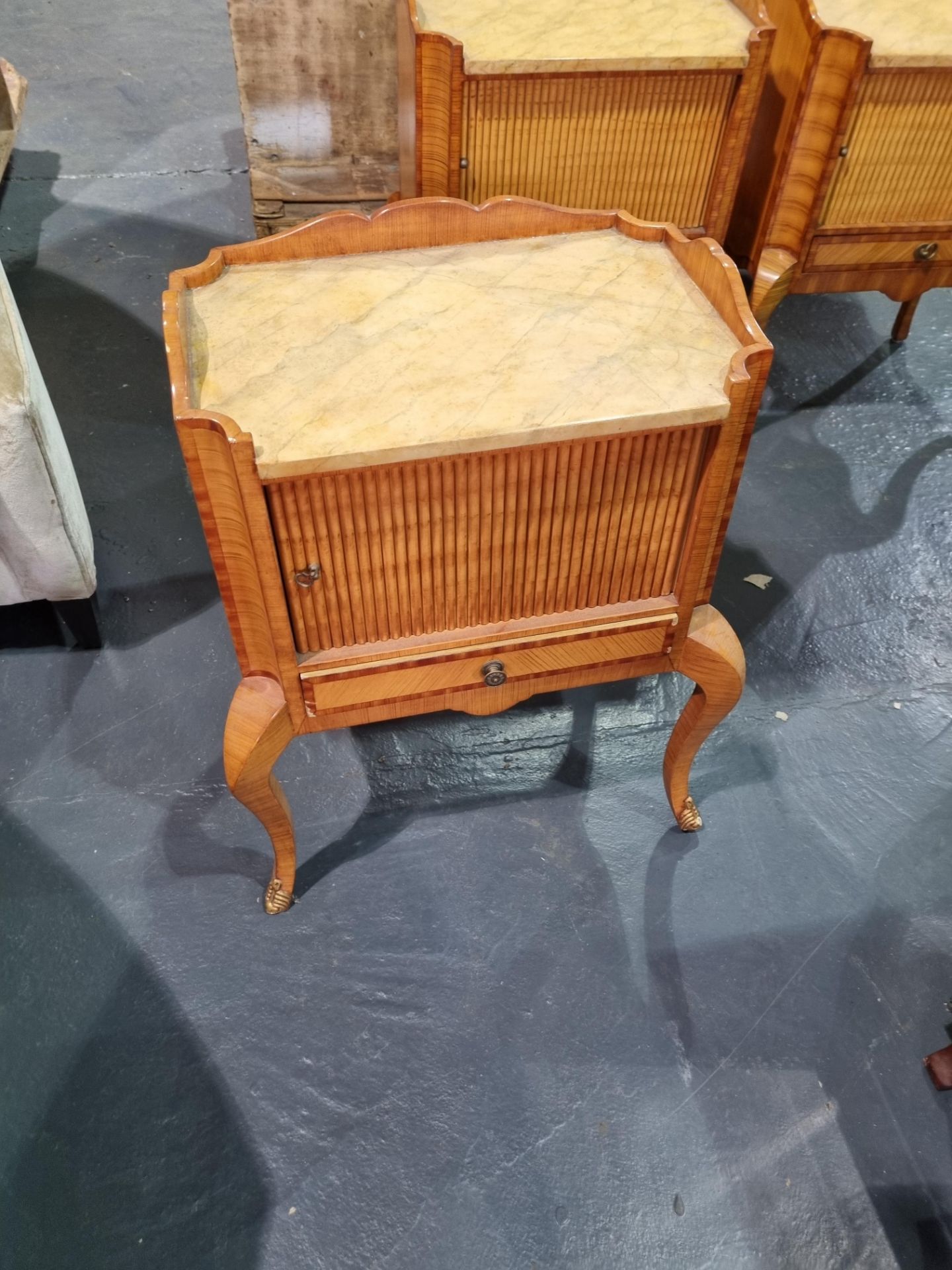 bedside table with sliding door and draw on bowed legs with brass feet Broken leg/foot Height 65cm