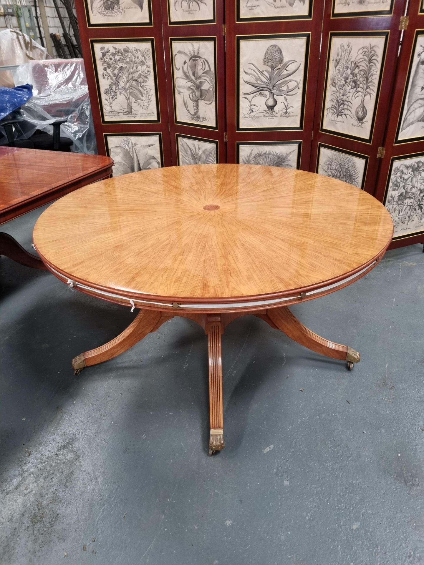 Arthur Brett Extending Circular Dining Table With Olivewood Veneers on one pedestal with five legs