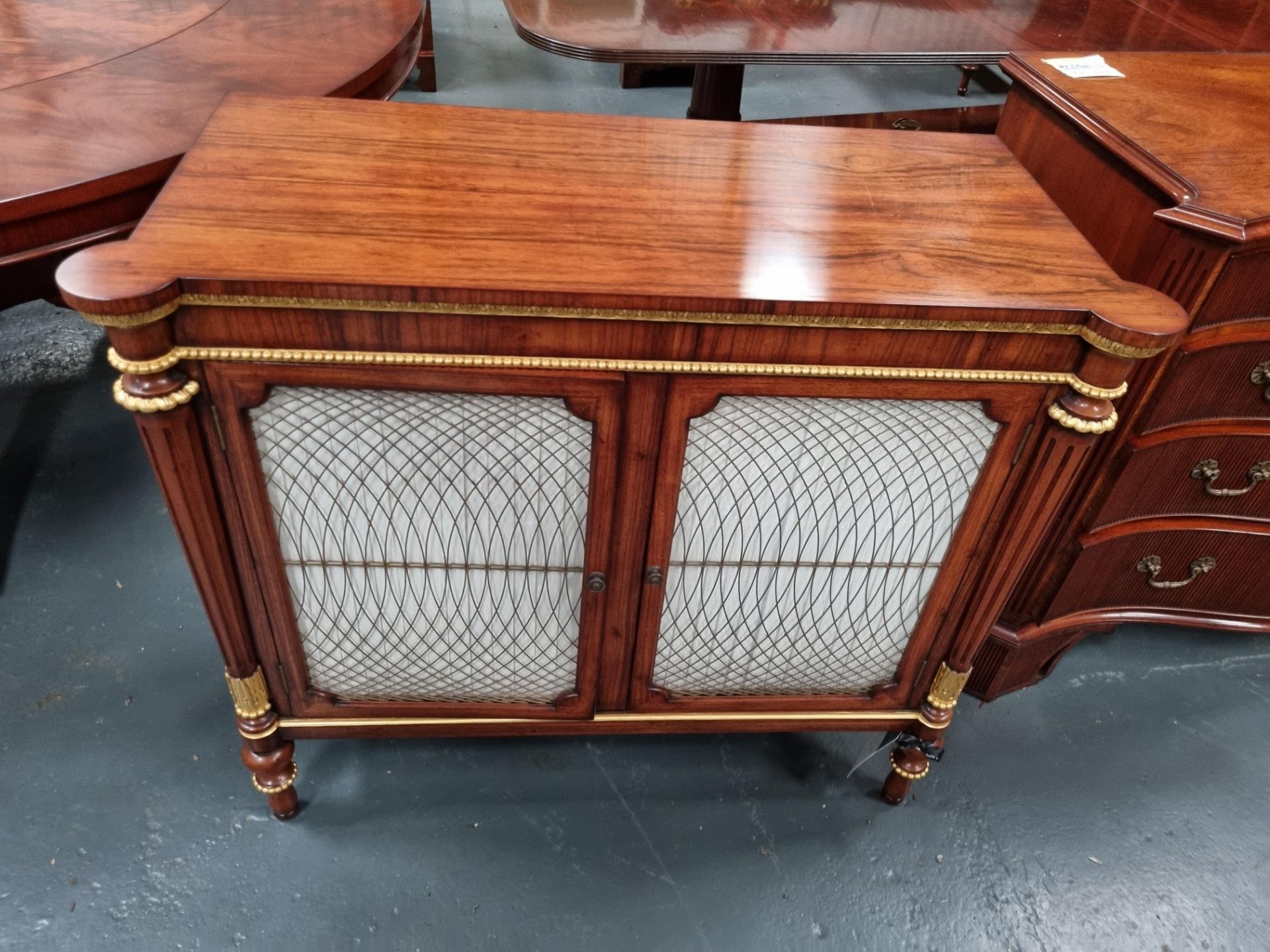 Arthur Brett Regency-style rosewood commode with gothic brass wire griolole doors and gilt