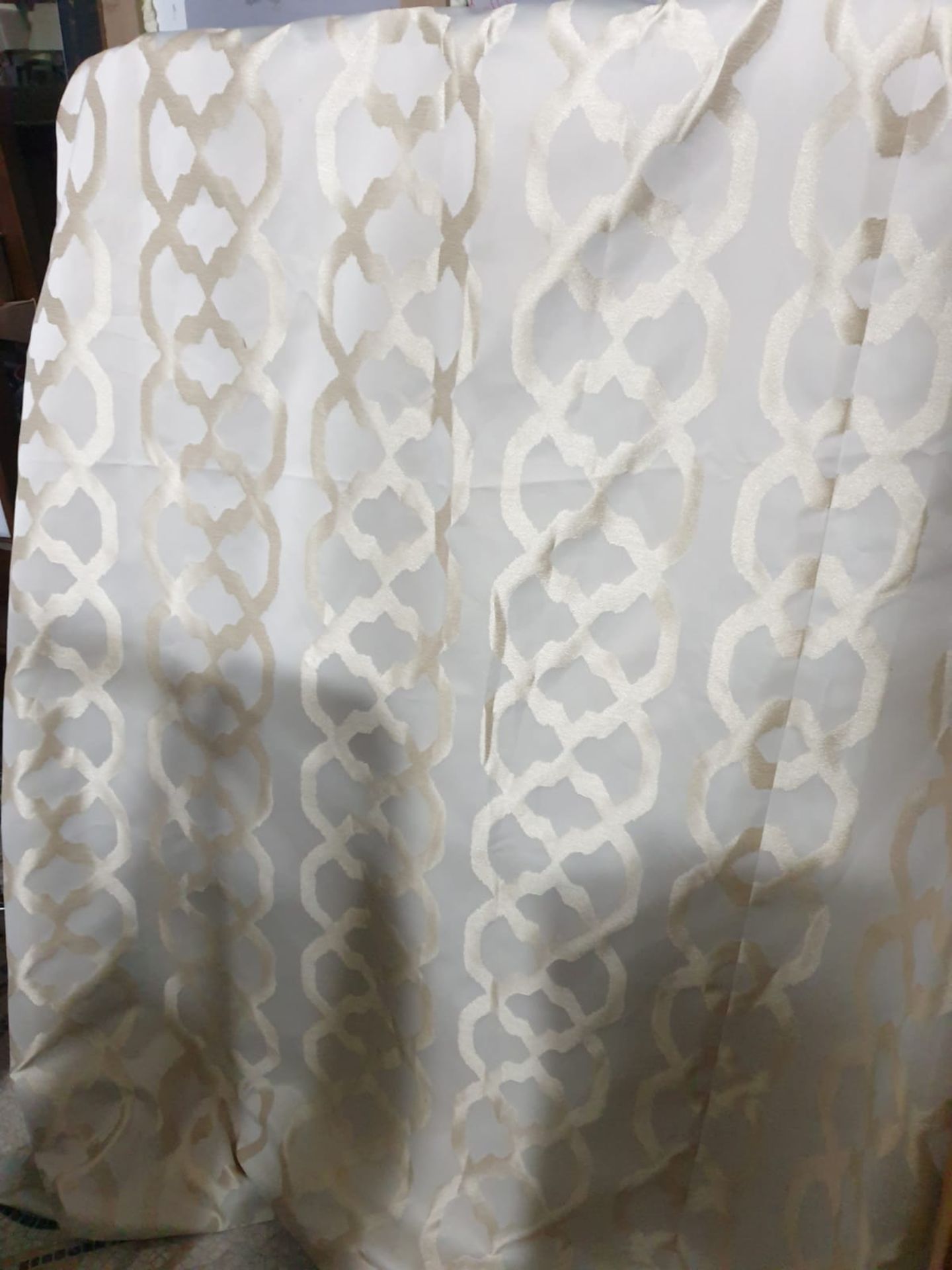 A pair of drapes cream circle motif each panel 108 x 242cn
