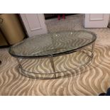 A polsihed Nickel Oval Coffee Table Glass Top 120 X 61 X 41cm