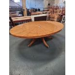 Arthur Brett E X Tending Circular Dining Table With Olivewood Veneers On One Pedestal With Five Legs