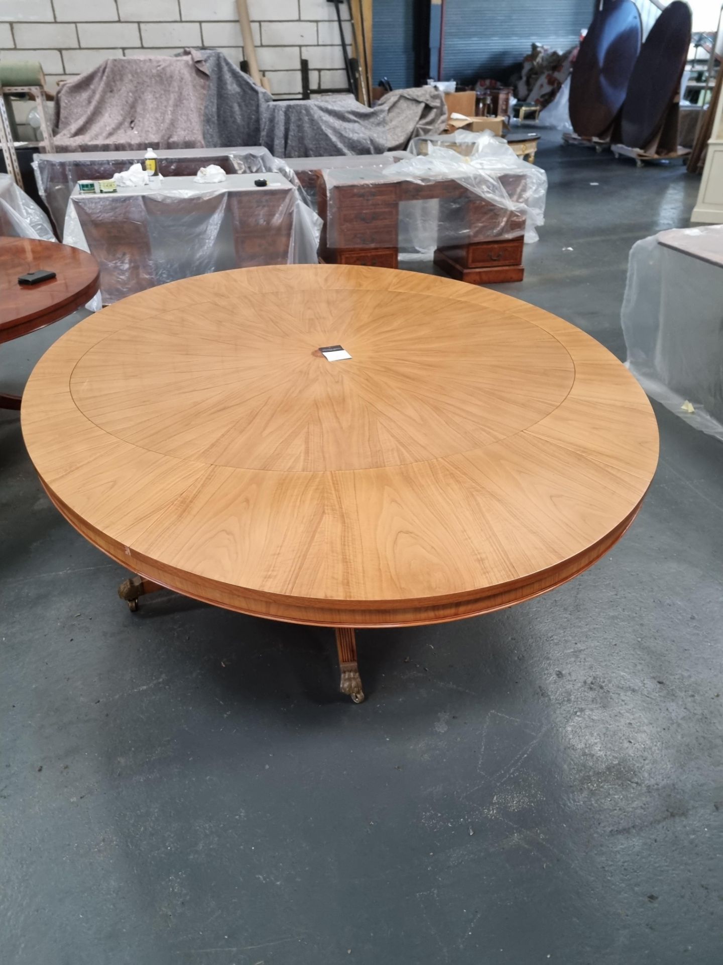 Arthur Brett E X Tending Circular Dining Table With Olivewood Veneers On One Pedestal With Five Legs