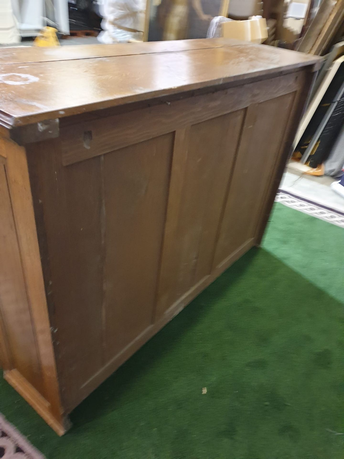 A Victorian oak office chest of drawers. With rounded corners and panelled sides, the top long - Image 4 of 4