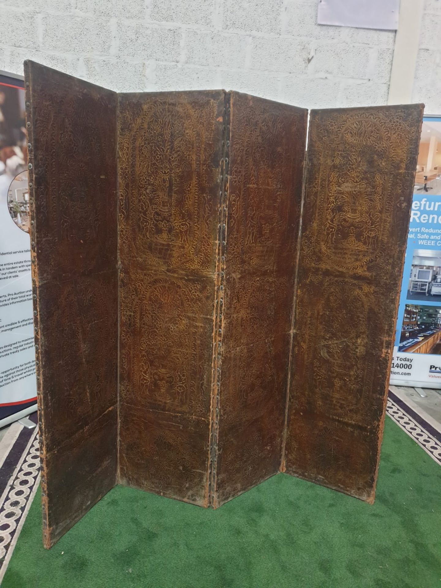 A 17th century style leather covered four fold screen, probably Spanish. Each fold covered in two - Bild 2 aus 3