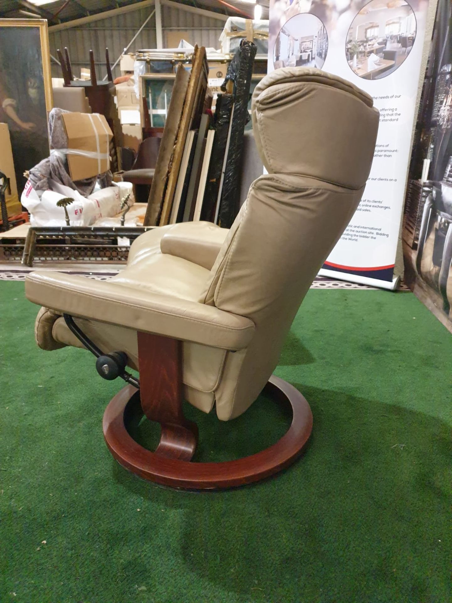 An Ekornes `Stressless` leather covered adjustable chair and stool, Norway. The pale caramel brown - Image 4 of 4