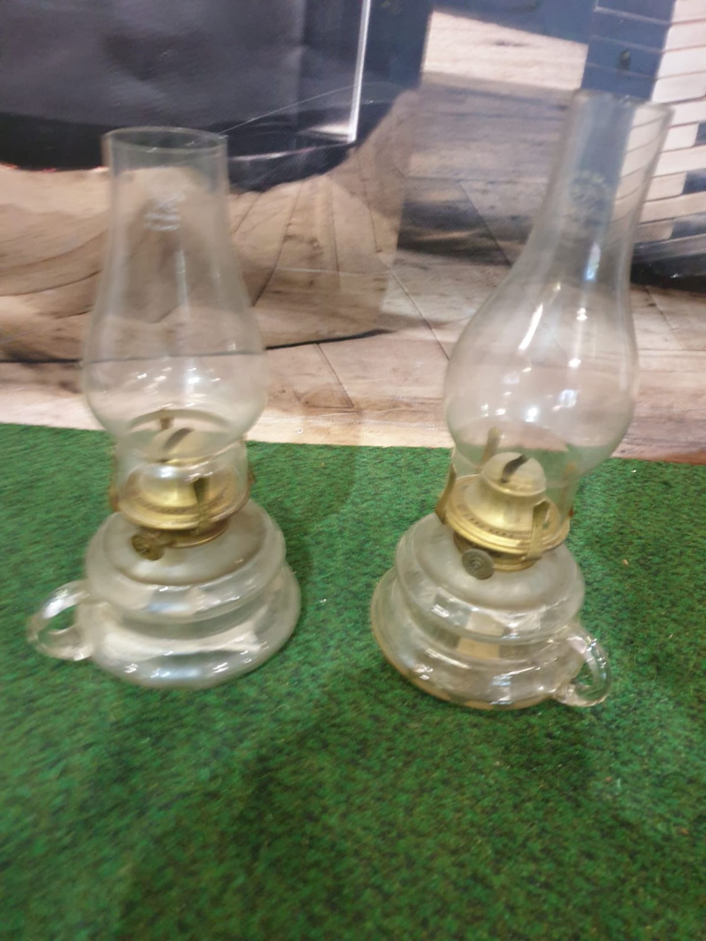 A pair of Griffin Brand glass oil lamps with carrying handles c. Circa 1920 Height 26 cm; Length - Image 2 of 3