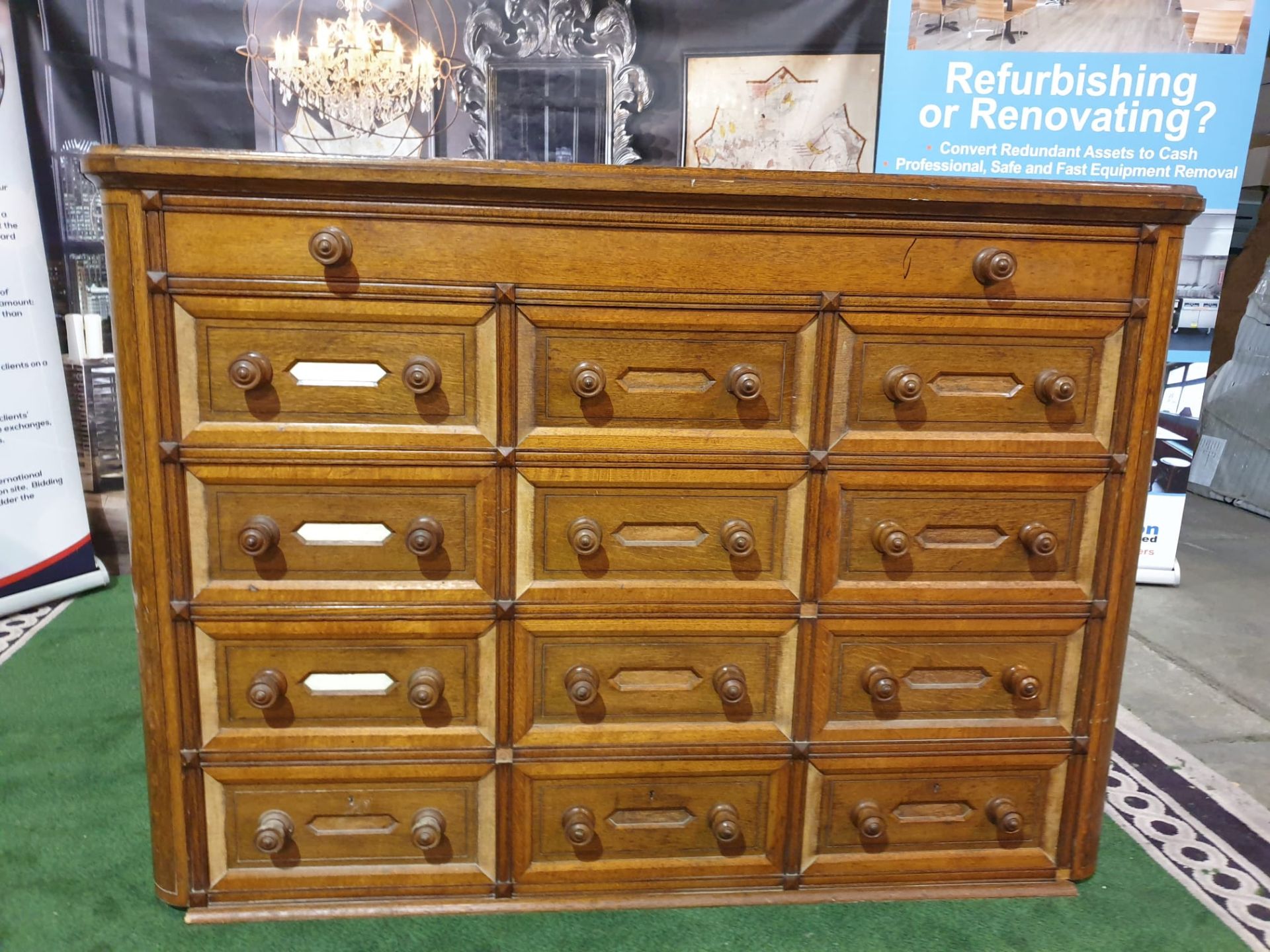 A Victorian oak office chest of drawers. With rounded corners and panelled sides, the top long