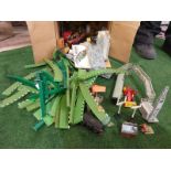 A box containing vintage Scalextric MM/T45G Green Straight Borders and train set accessories as