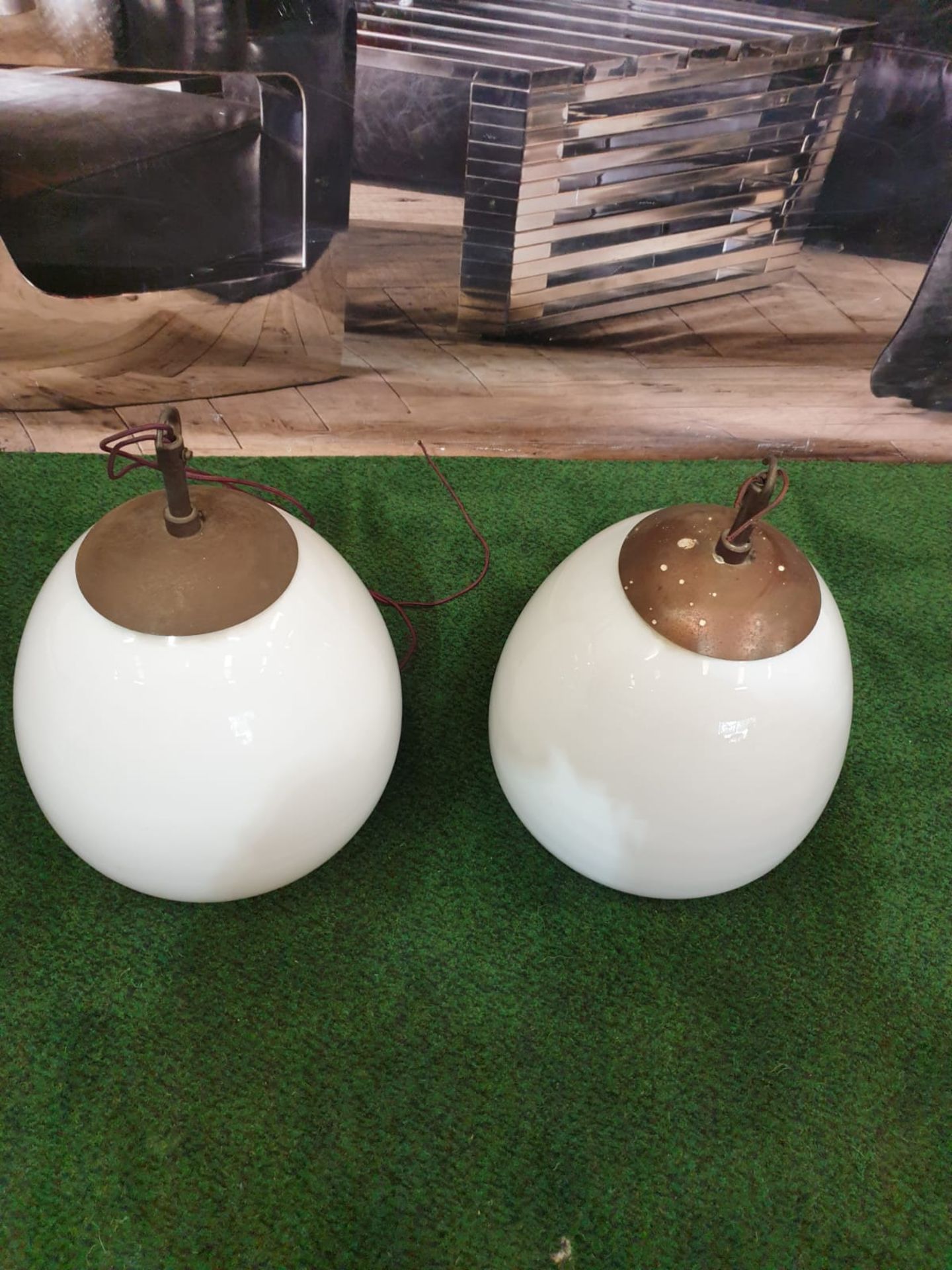 A pair of white glass and metal mounted pendant lights.Of ovoid form and with copper caps and - Image 2 of 3