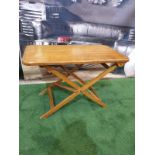 A polished teak folding table 71 x 40 x 4cm