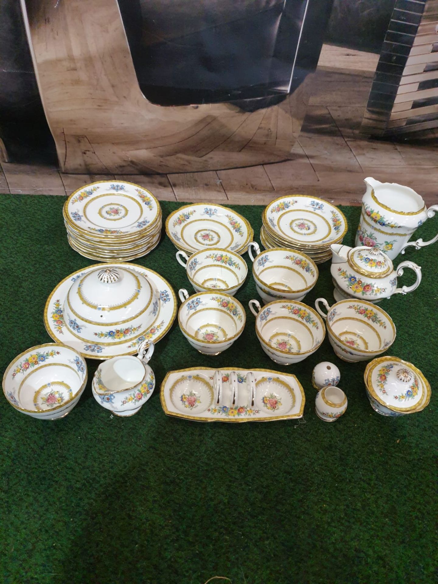 A Paragon England fine bone China partial tea service floral with gold rim comprising of 11x serving