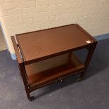 A teak adjustable serving trolley / gueridon The lower tier rising to form a double section upper
