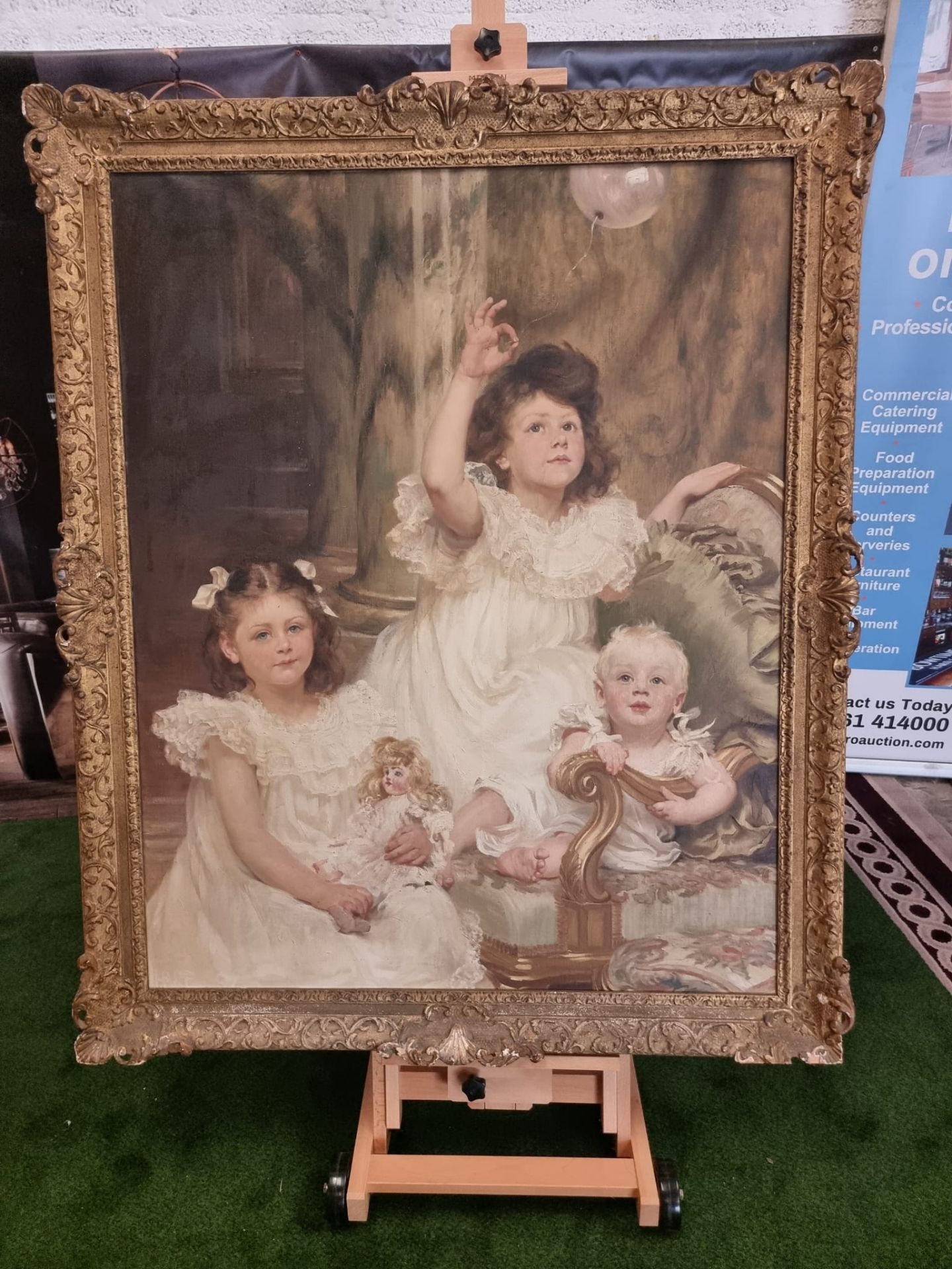 Framed oil on canvas Portrait of 3 Children with balloon and doll in subject. In ornate gilt and