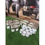 A quantity of enamel tins and cups as found with chrome clip lids 5 x large tins 25 x 13 x 10cm 6x