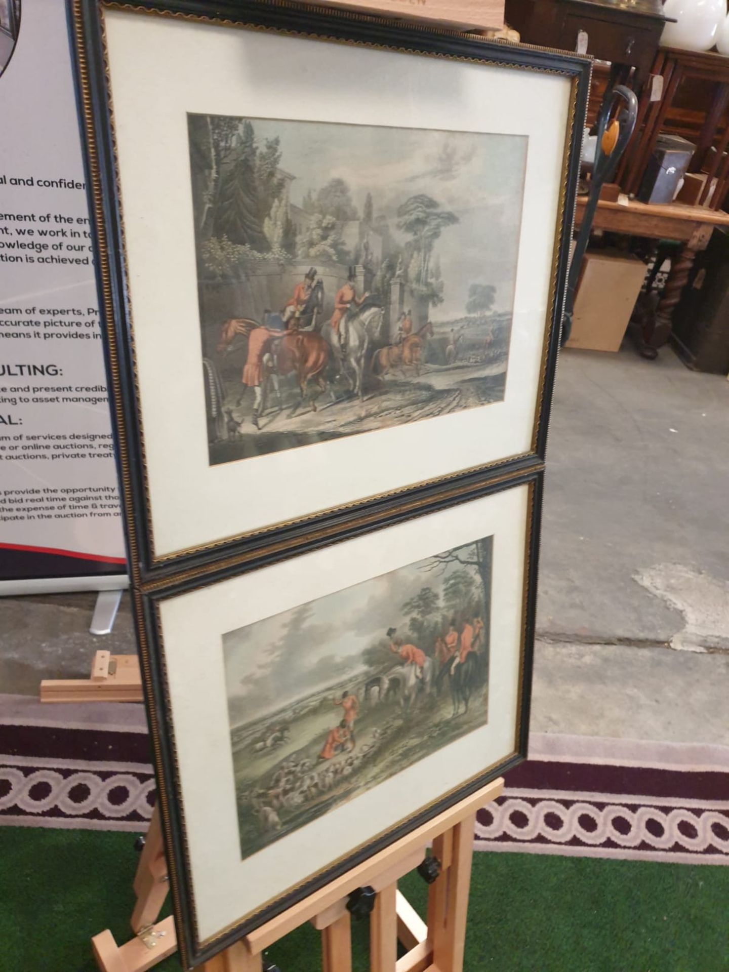 A set of 2 framed Fox hunting prints in Black & Gold frame 50 x 42cm