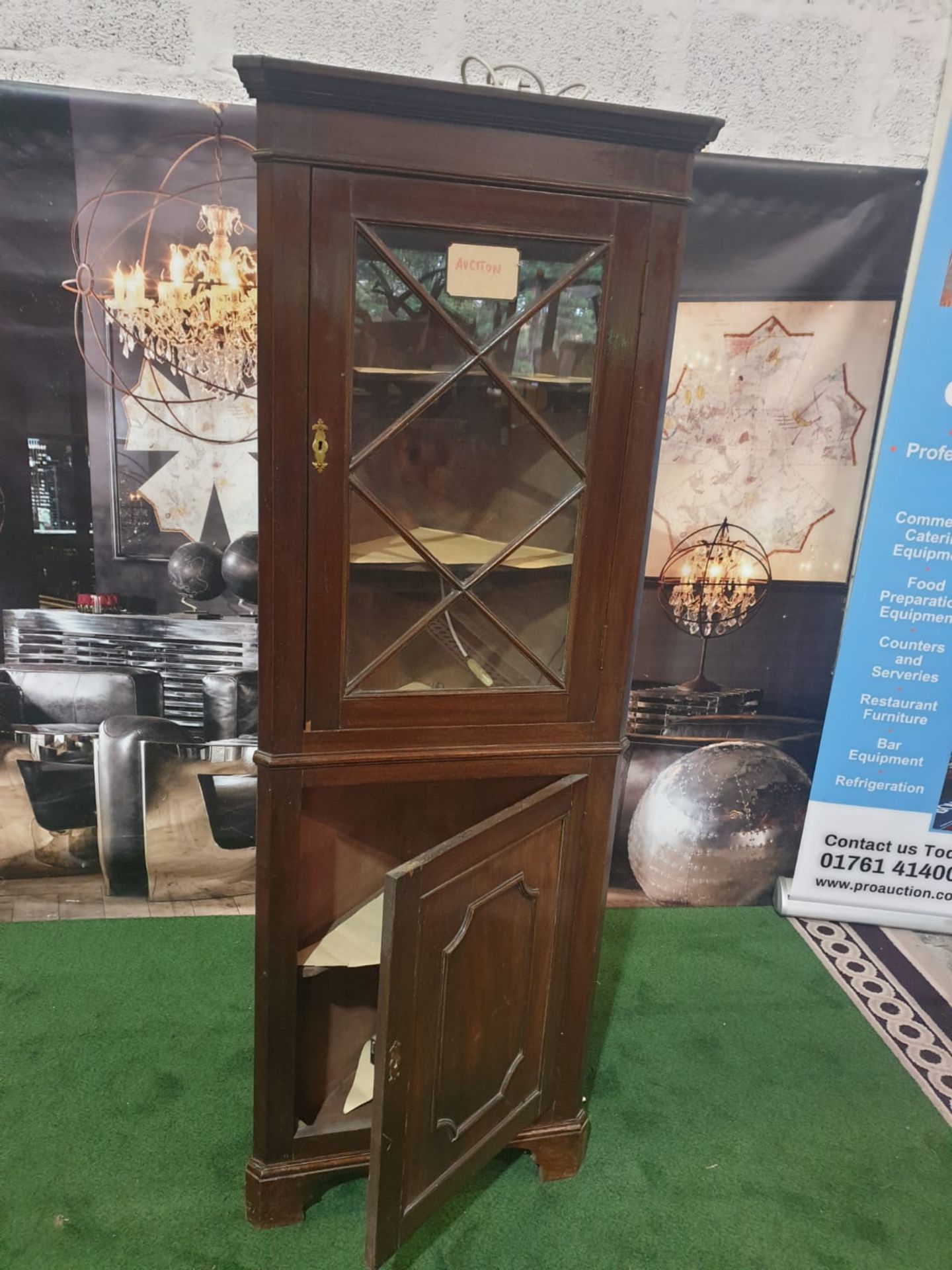 A mahogany standing corner cupboard in George III style. The moulded cornice above a single glazed - Image 2 of 5