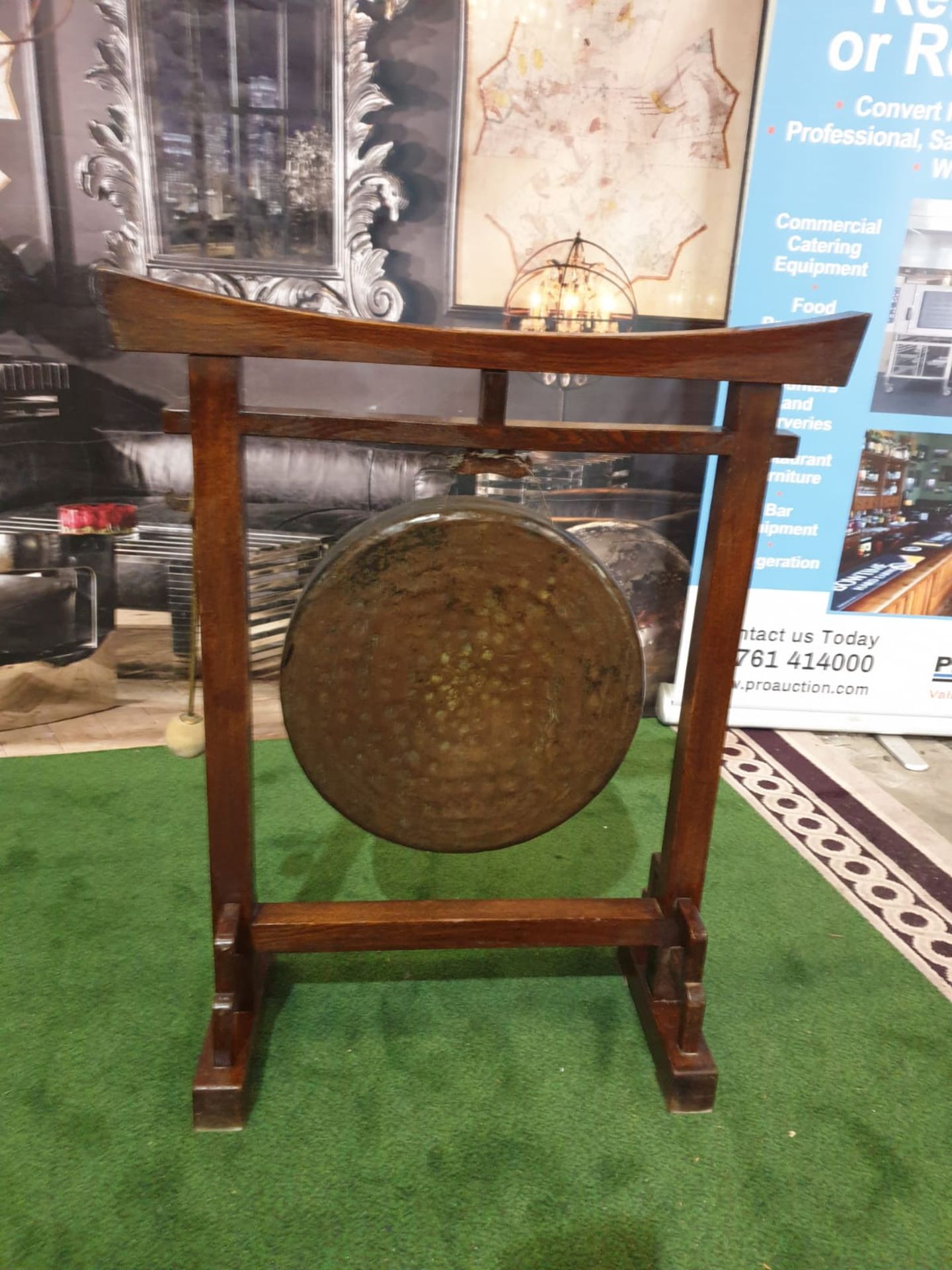 An Oriental brass gong on wooden stand An oriental, possibly Chinese circular hammered brass gong on - Image 2 of 6