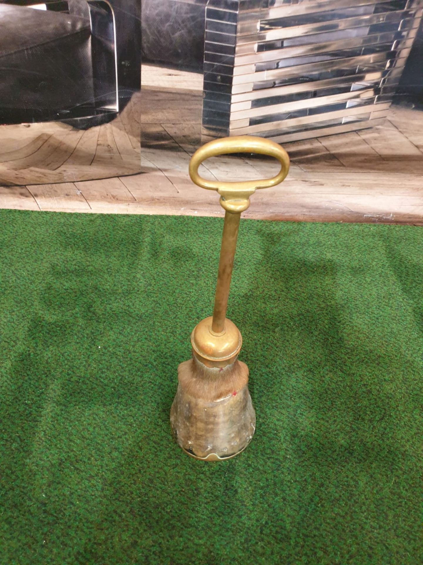 A Victorian brass mounted horse's hoof door stop.The hoof mounted with brass with a ring handle - Image 2 of 3