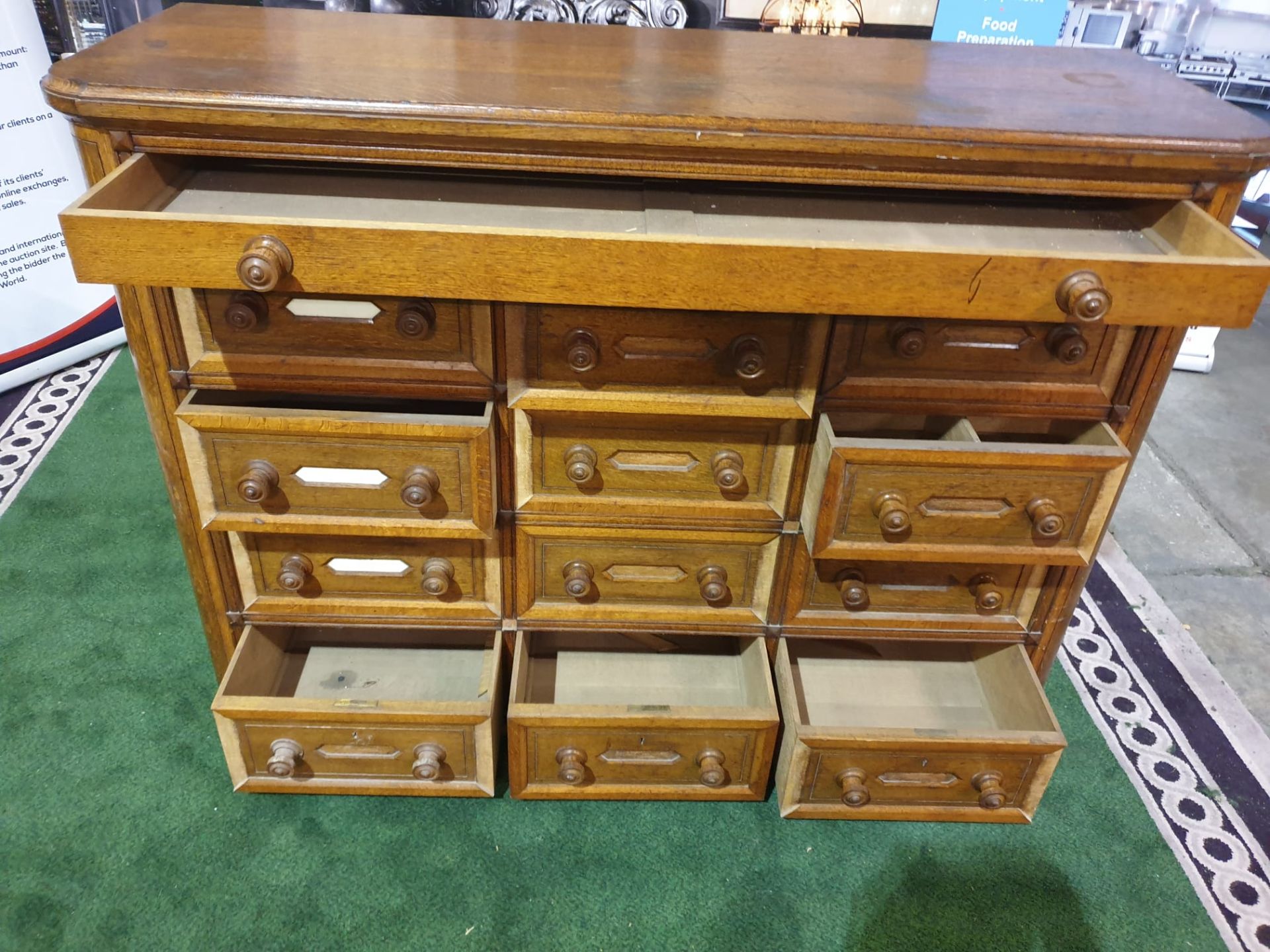 A Victorian oak office chest of drawers. With rounded corners and panelled sides, the top long - Image 3 of 4