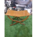 A polished mahogany folding table 76 x 43 x 49cm (Nb bar latch missing)