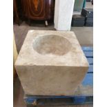 A marble square font with bowl scooped out 46 x 44 x 39cm
