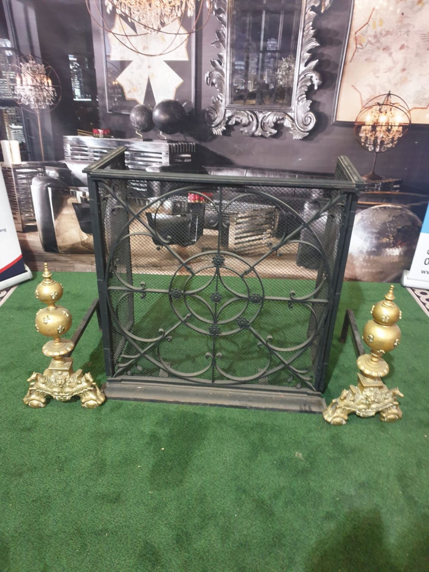 A cast metal fire guard with a pair of Brass Fire Andirons Ornate yet simple and elegant design in