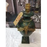 Green and brass urn lamp with goat head motif no shade damage noted (SR249)