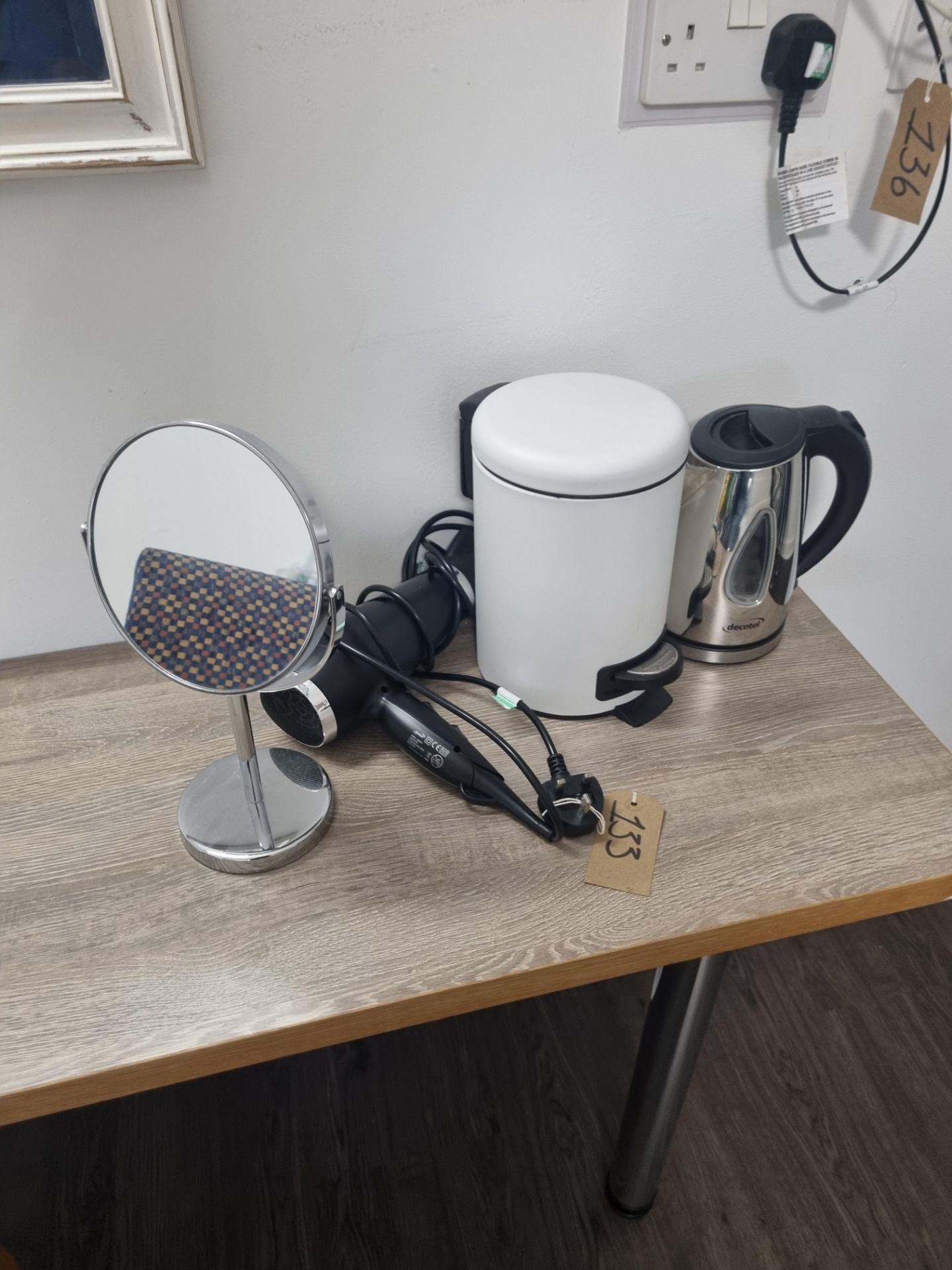 A Room Set Comprising Of White Pedal Bin Hair Dryer Shaving Mirror and Kettle