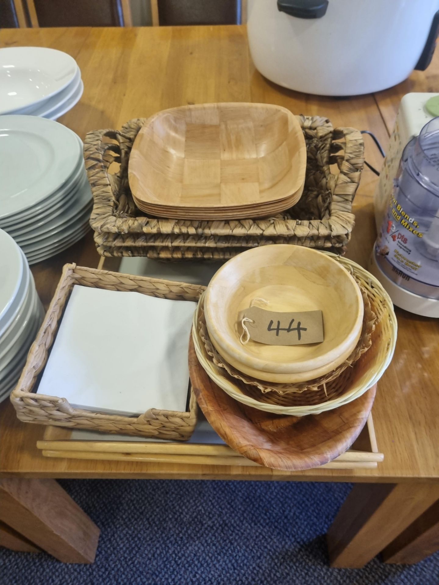 Various Wooden Bowls Wicker Baskets And Wooden Serving Trays